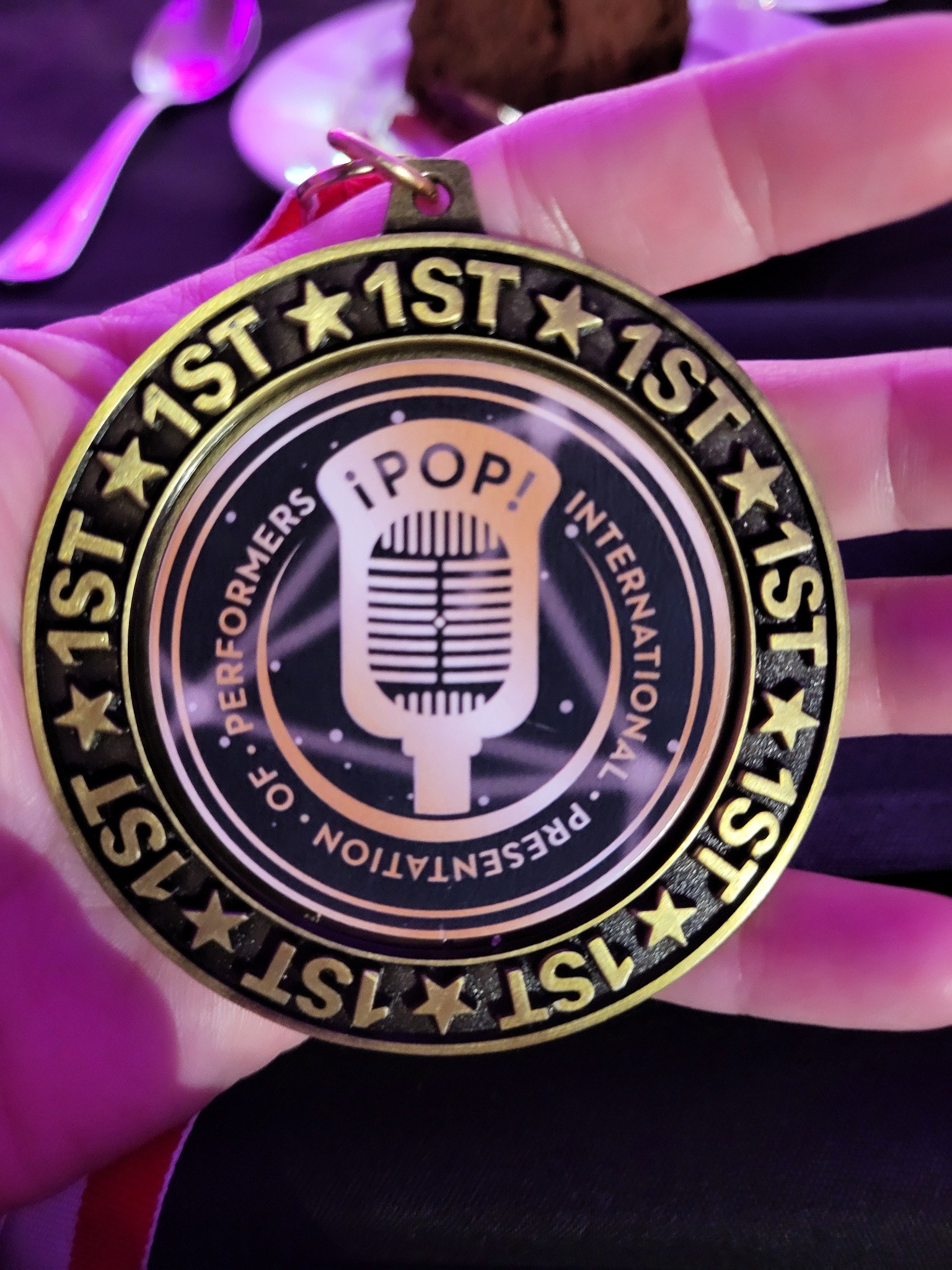 Close view of Caitlyn's iPOP first-place medal